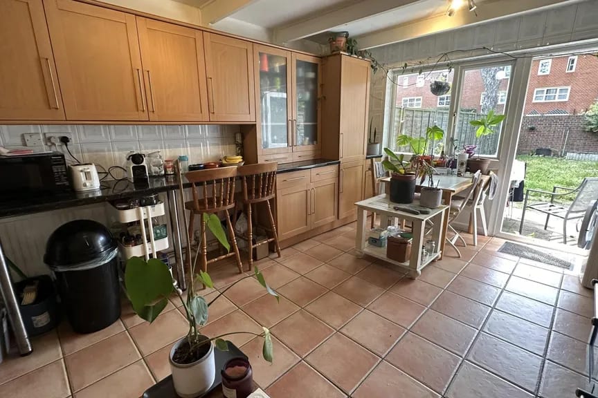Kitchen — cleared and professionally lit — before